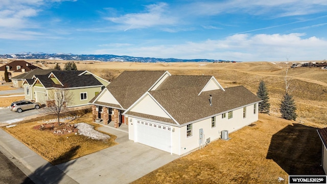 birds eye view of property with a mountain view