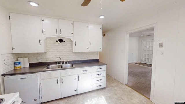 kitchen with a sink, white cabinetry, dishwasher, tasteful backsplash, and dark countertops