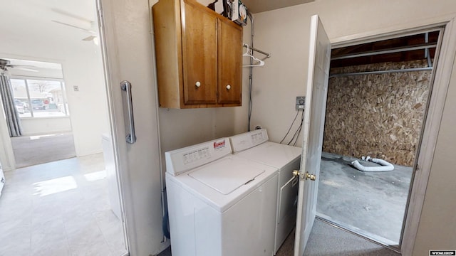 laundry room featuring a ceiling fan, cabinet space, and independent washer and dryer