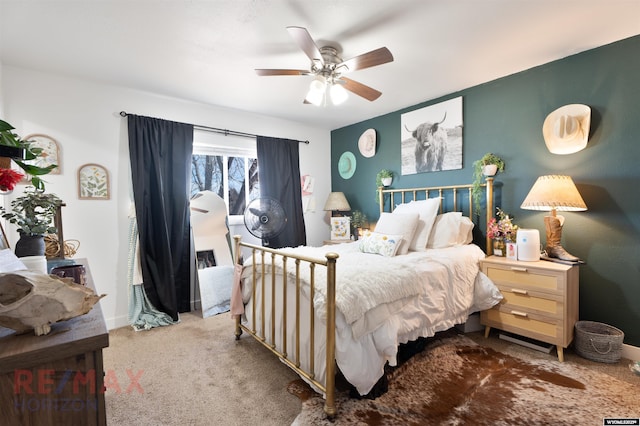 bedroom with carpet flooring, a ceiling fan, and baseboards