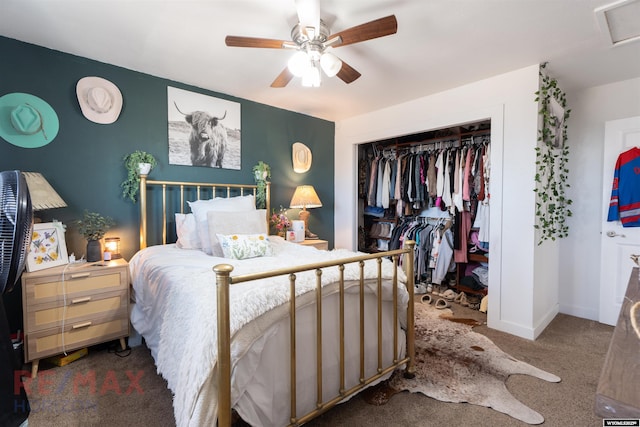 bedroom featuring a ceiling fan, baseboards, a closet, carpet, and attic access