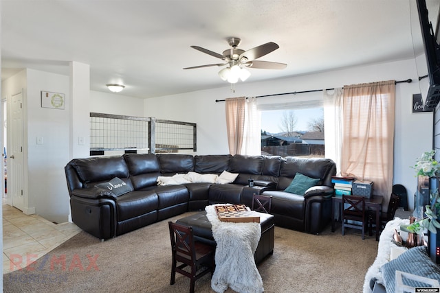 living room with ceiling fan and carpet flooring