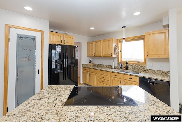 kitchen with light brown cabinets, black appliances, a sink, and recessed lighting