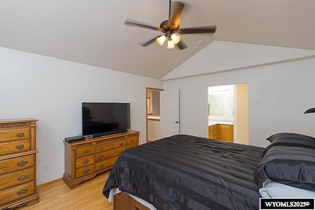 bedroom with light wood-type flooring, ceiling fan, vaulted ceiling, and ensuite bathroom