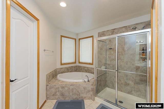 full bath featuring a stall shower, a bath, and tile patterned floors