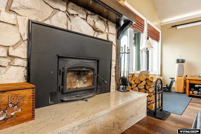 details featuring a textured ceiling and wood finished floors