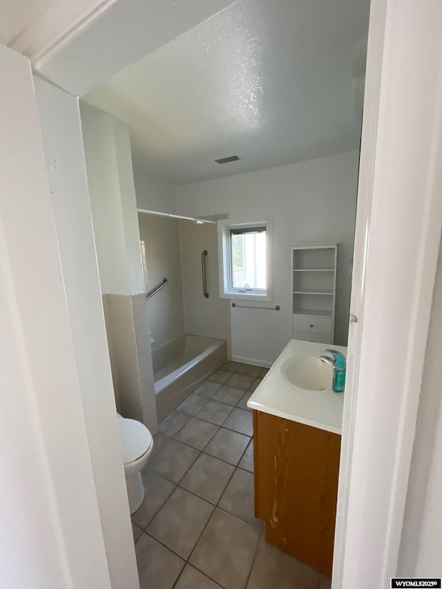 full bathroom featuring visible vents, toilet, shower / tub combination, tile patterned floors, and vanity