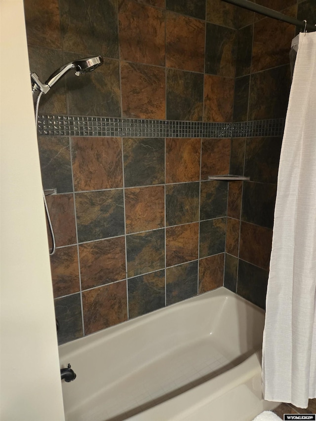 full bath featuring shower / bath combo with shower curtain