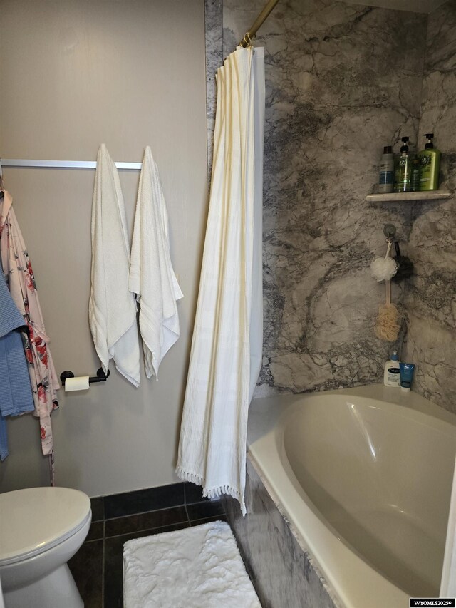 full bath with a bathtub, toilet, a shower with shower curtain, and tile patterned floors