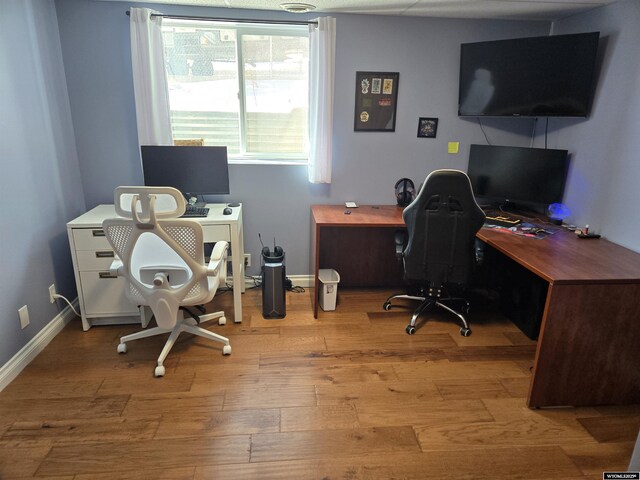 office featuring light wood-style floors and baseboards