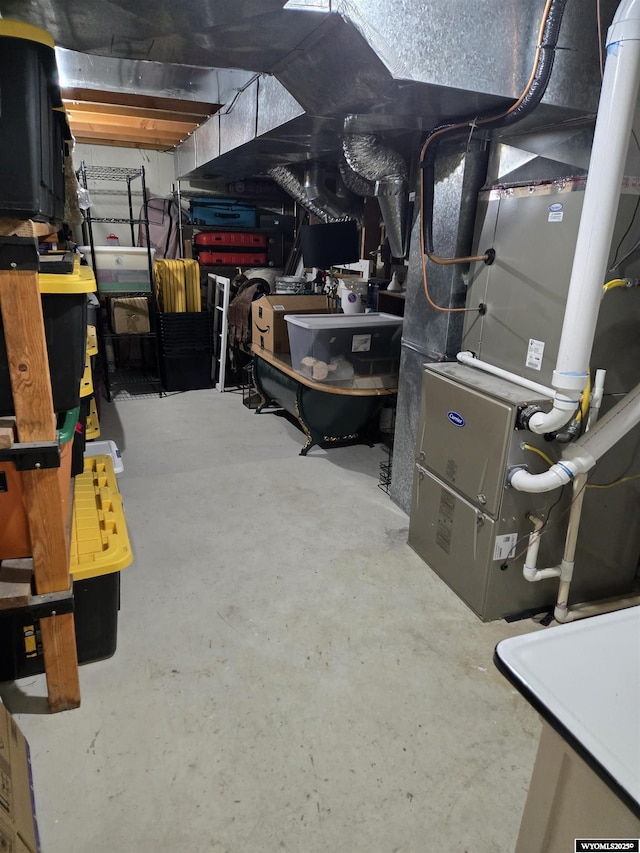 unfinished below grade area featuring heating unit