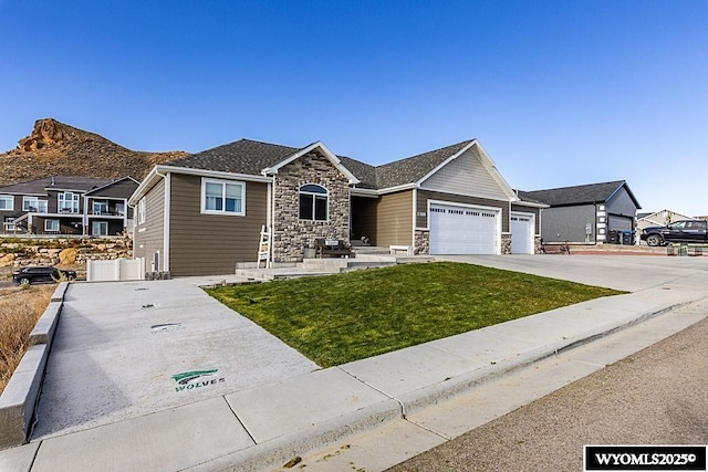 ranch-style home featuring a garage, stone siding, driveway, roof with shingles, and a front lawn