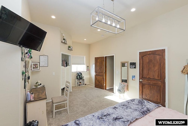 carpeted bedroom with recessed lighting