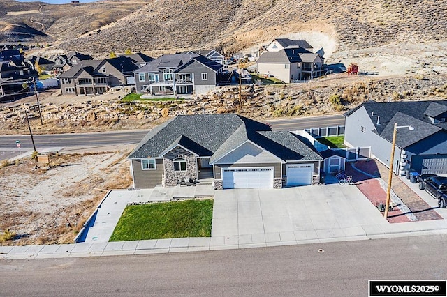 bird's eye view featuring a residential view and a mountain view