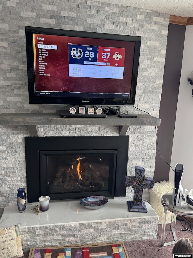 interior details featuring a warm lit fireplace