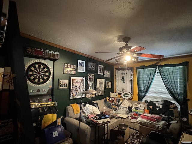 interior space featuring ceiling fan and crown molding