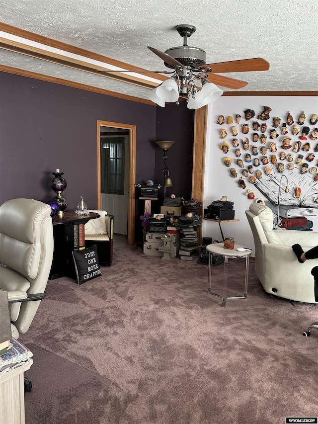 interior space featuring a textured ceiling, carpet, and a ceiling fan