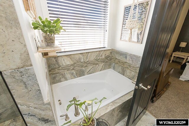 bathroom featuring a whirlpool tub