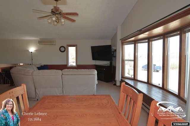 dining room featuring vaulted ceiling, a wall unit AC, a wealth of natural light, and a ceiling fan