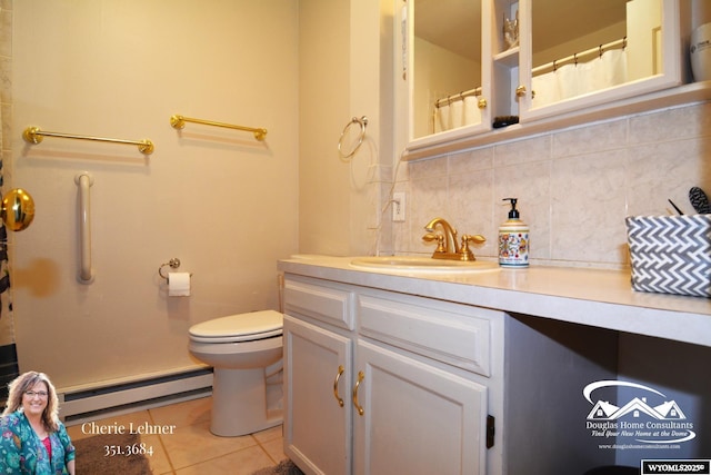 full bath with tile patterned flooring, toilet, vanity, baseboard heating, and tasteful backsplash