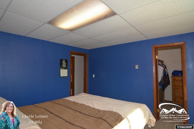 bedroom featuring a paneled ceiling