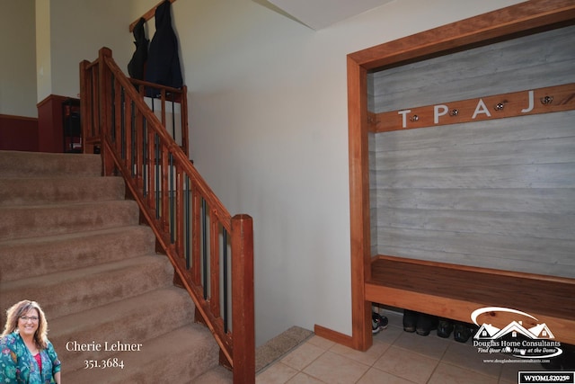 stairway with tile patterned flooring