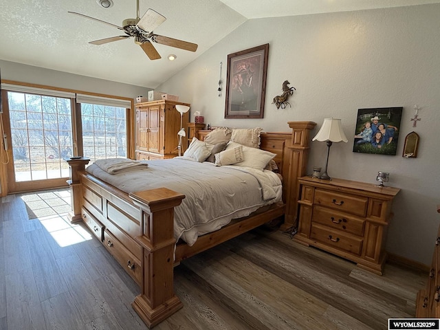 bedroom featuring access to exterior, lofted ceiling, a ceiling fan, a textured ceiling, and wood finished floors