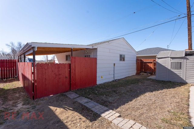 view of shed featuring fence