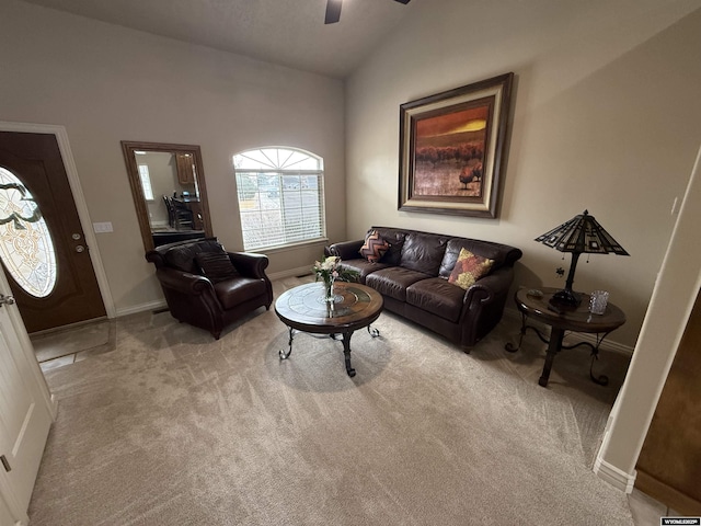 living room with vaulted ceiling, carpet, a ceiling fan, and baseboards