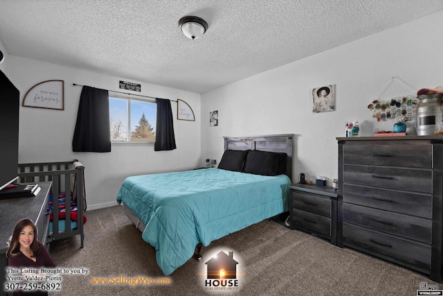 carpeted bedroom featuring a textured ceiling