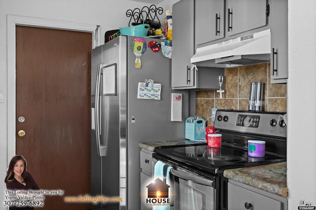 kitchen featuring under cabinet range hood, tasteful backsplash, appliances with stainless steel finishes, and gray cabinets