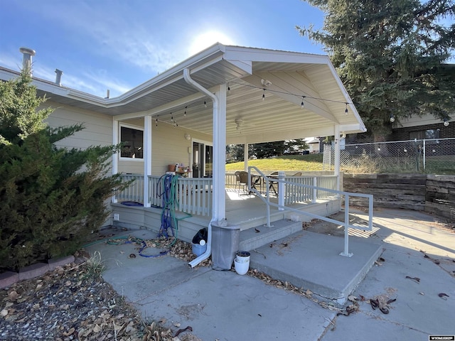 view of patio / terrace featuring fence