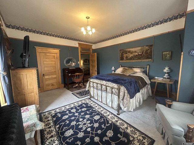 bedroom with carpet floors and an inviting chandelier