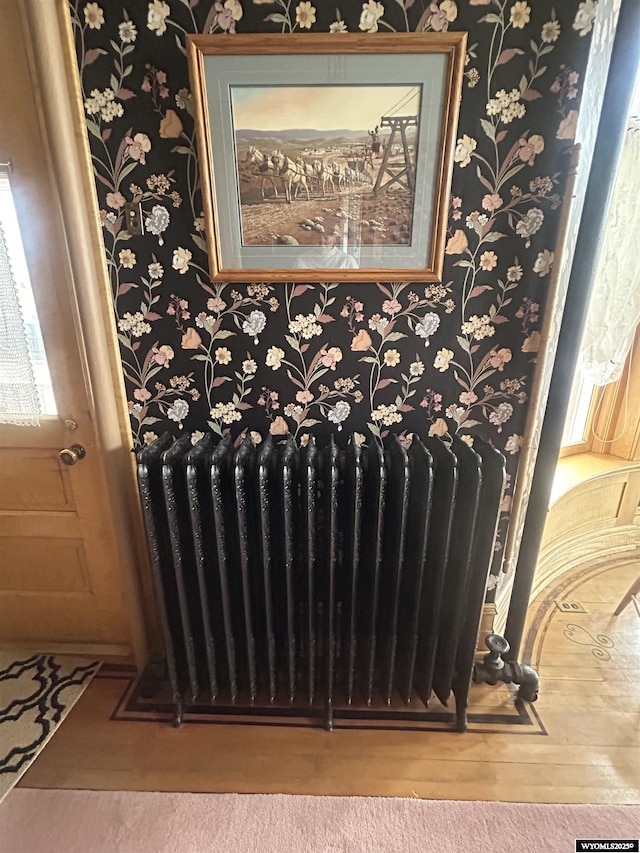 details featuring radiator and wallpapered walls