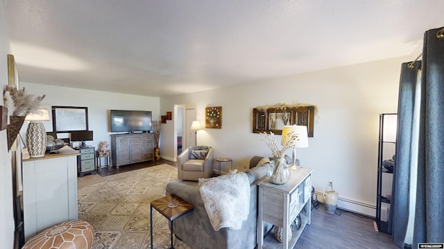 living area with baseboard heating and wood finished floors