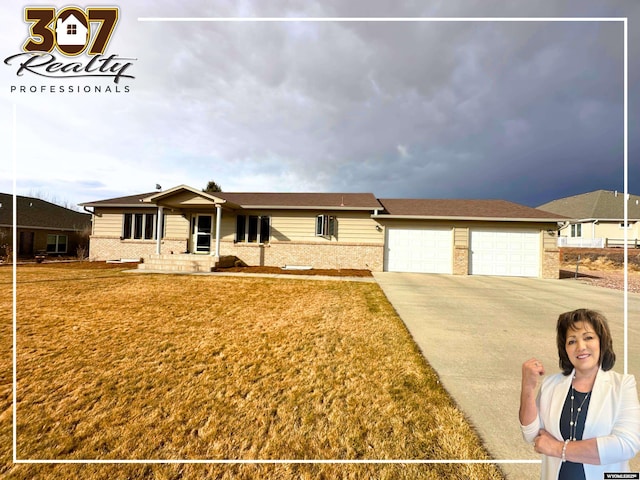 ranch-style house with brick siding and a front lawn