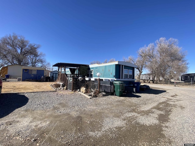 view of front of home with an outbuilding