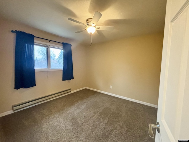 spare room with a baseboard heating unit, dark carpet, baseboards, and ceiling fan