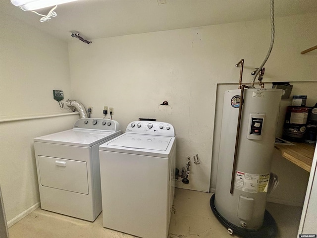 laundry area with water heater, laundry area, and washer and dryer