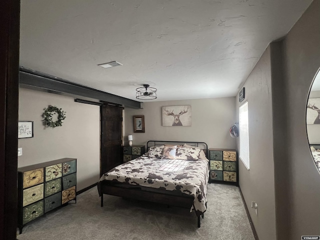 carpeted bedroom featuring baseboards