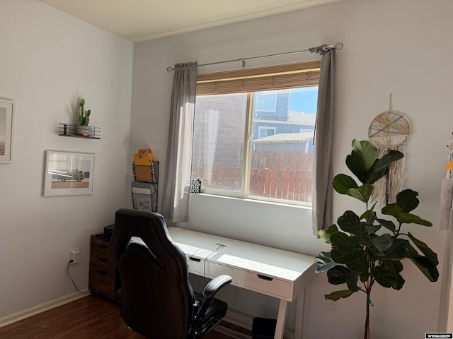 office space with dark wood-type flooring and baseboards