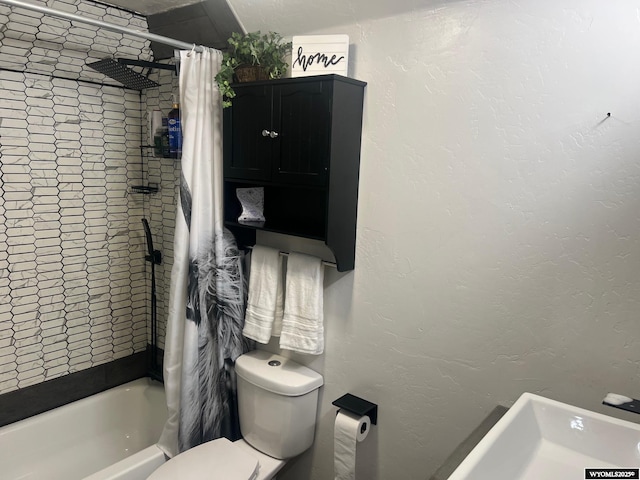 full bath featuring toilet, shower / bathtub combination with curtain, and a textured wall