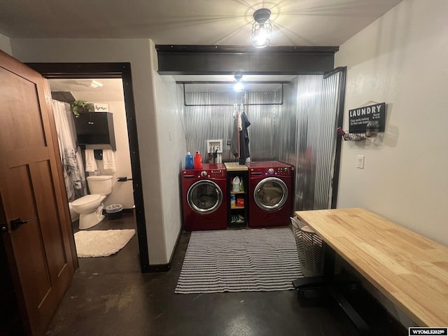 washroom with laundry area and washing machine and clothes dryer