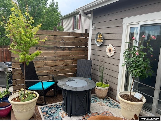 wooden deck with grilling area and fence