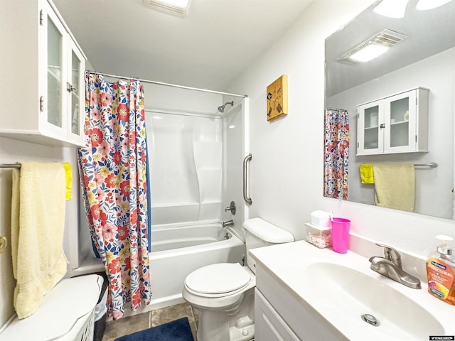 full bath featuring vanity, visible vents, shower / bath combo, tile patterned flooring, and toilet