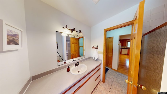 bathroom with tile patterned flooring and vanity