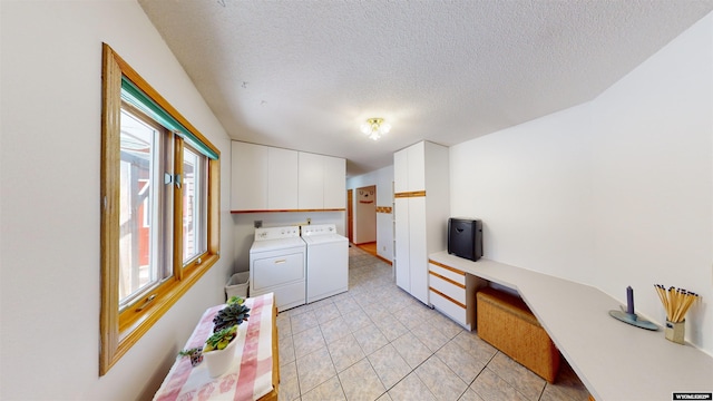 kitchen with light countertops, washer and dryer, white cabinets, and a textured ceiling