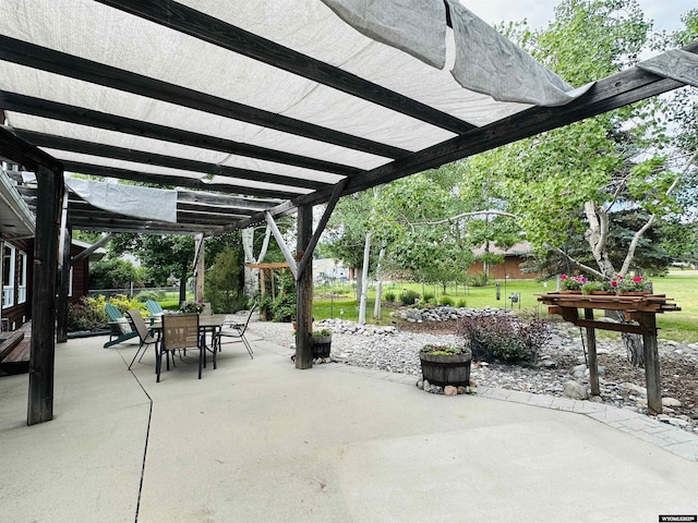 view of patio / terrace featuring a pergola and outdoor dining space