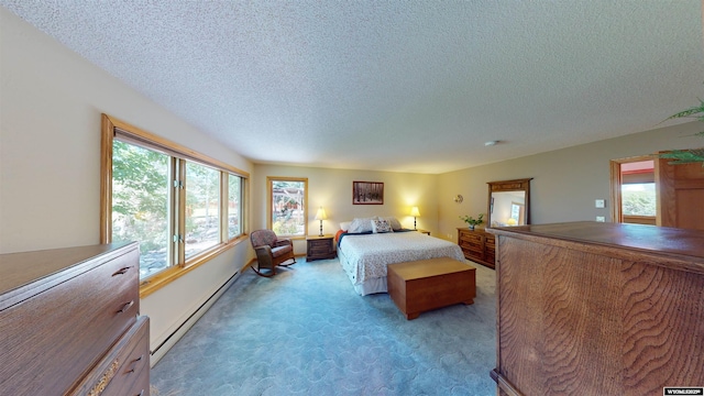 bedroom featuring a baseboard heating unit, light colored carpet, and a textured ceiling