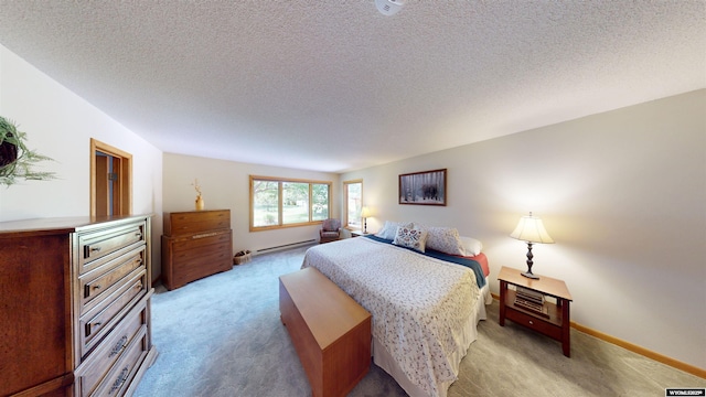 bedroom with a baseboard radiator, light carpet, a textured ceiling, and baseboards